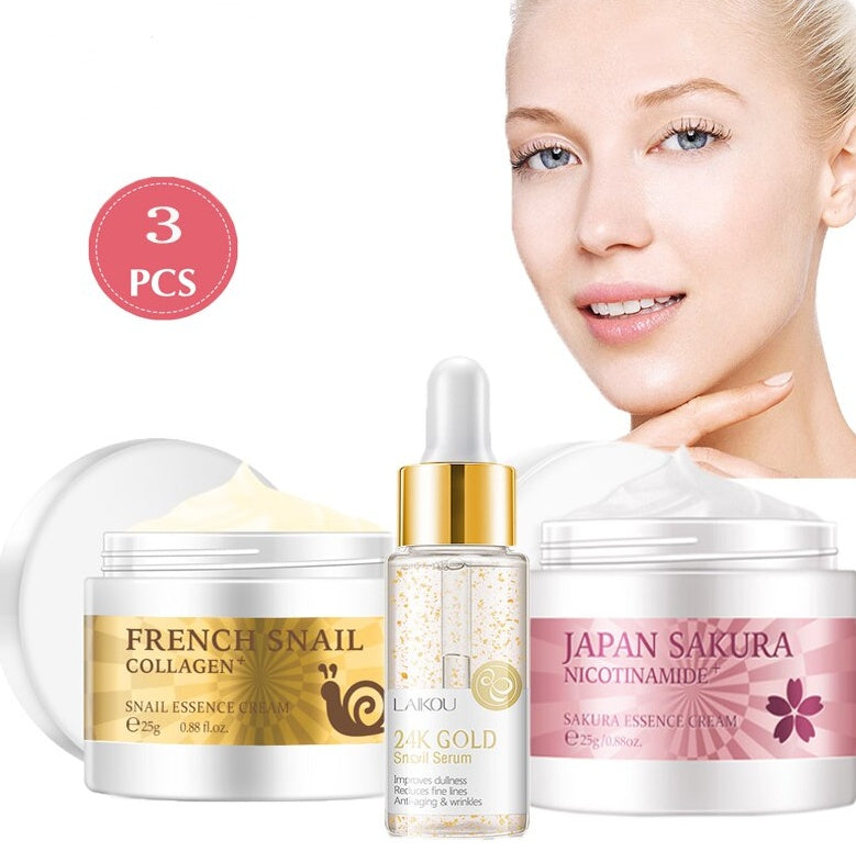 Three-piece skincare set with cream jars and a gold dropper serum bottle