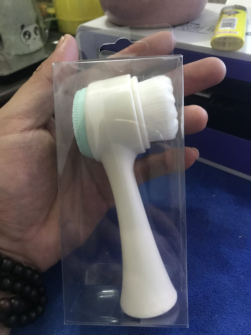 White face cleansing brush head attachment, shown in clear plastic box