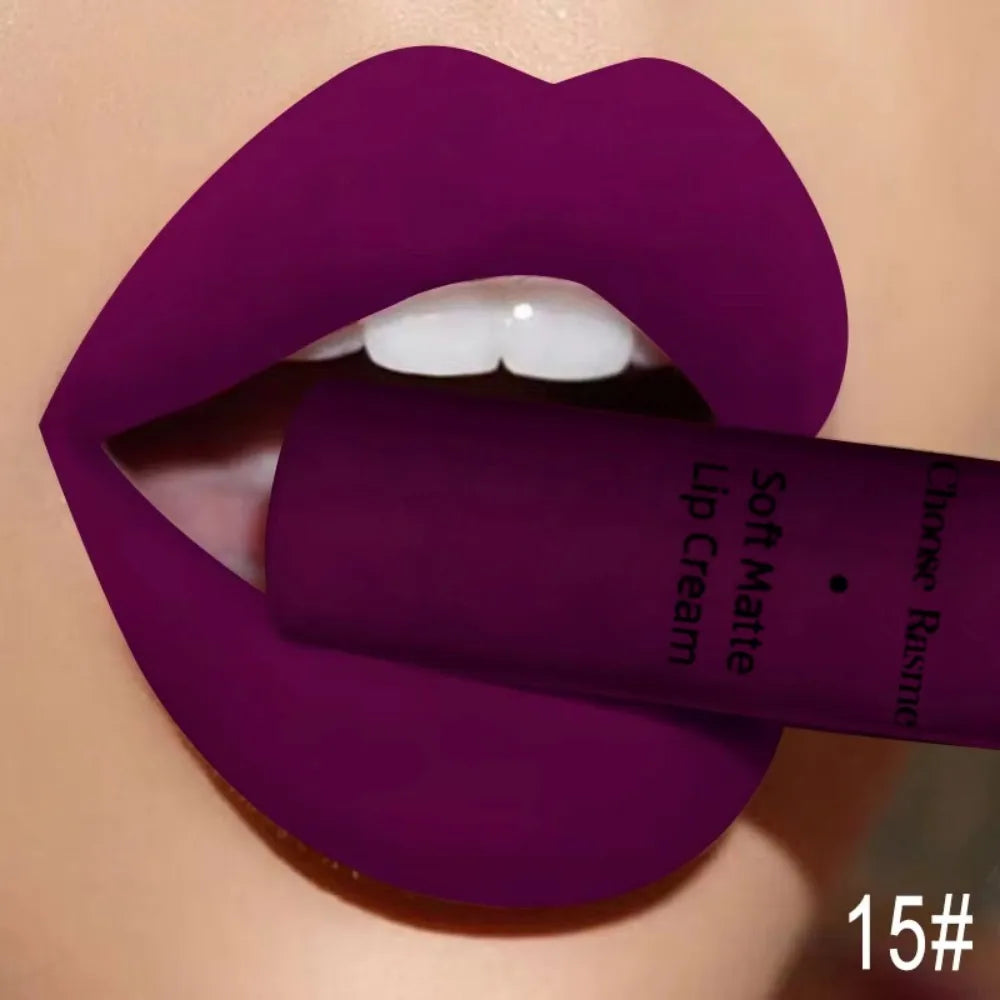Soft matte lip cream on rich purple lips, showing liquid lip color tube