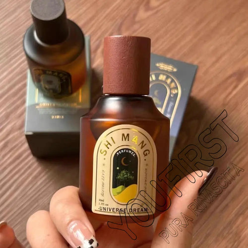 Amber SHIMANG perfume spray bottle with dark cork cap and gold label