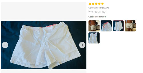 White swim trunks with elastic waistband and white drawstring, side pockets.
