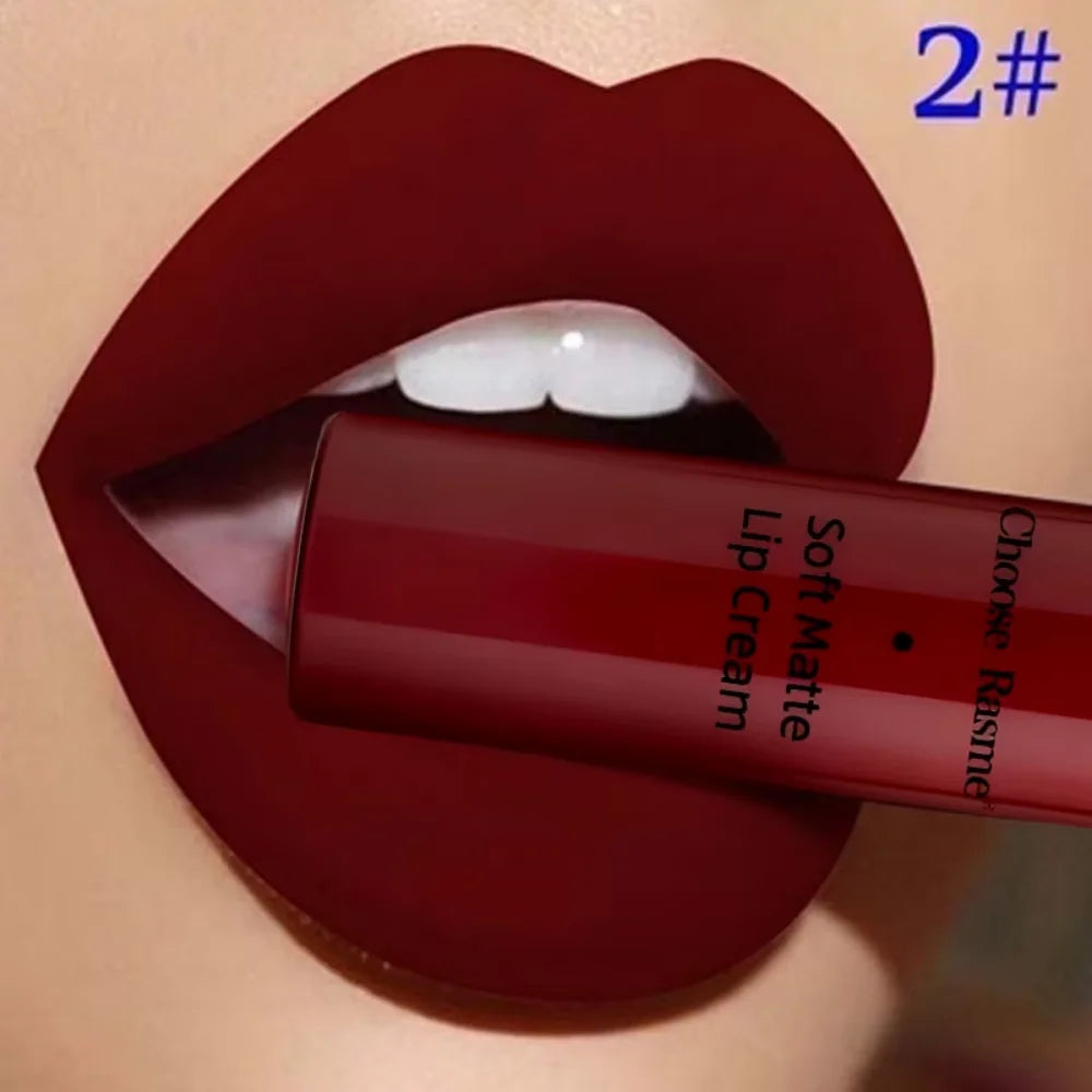 Soft matte lip cream on deep red lips, showing liquid lip color tube