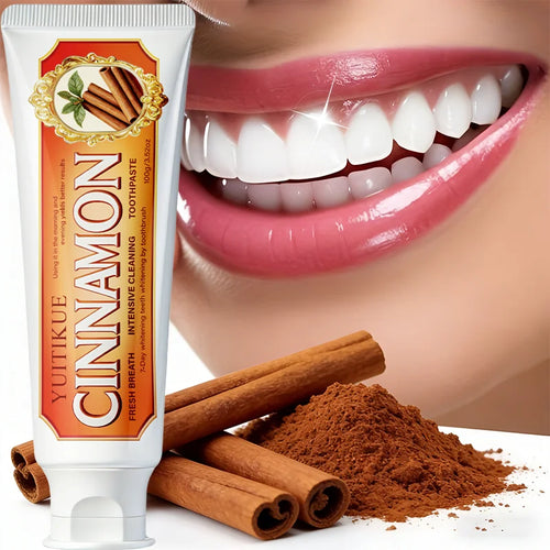 Cinnamon toothpaste tube with cinnamon sticks and powder beside teeth and lips