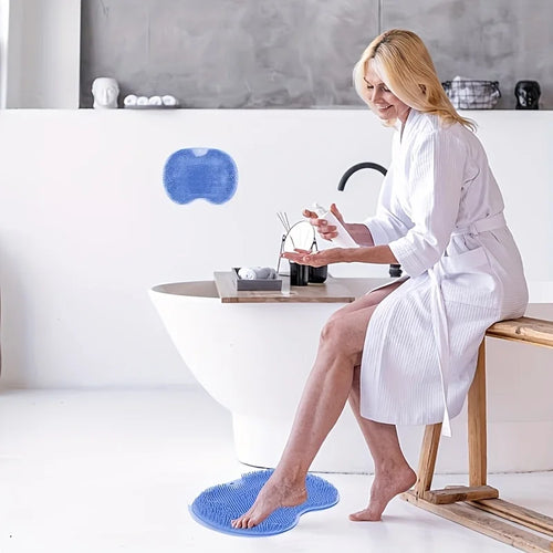 Blue foot scrubber massage mat with anti-slip bumps, person standing barefoot