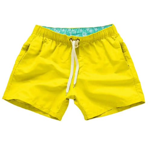 Yellow swim shorts with elastic waist and white drawstring, side pockets.