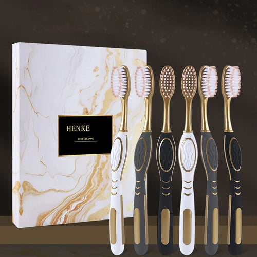 6-pack toothbrush set with black and white handles, gold accents, soft bristles