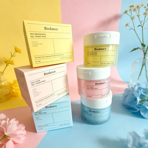 Biodance gel toner pads and skincare ampoule jars with pastel yellow, pink, and blue boxes