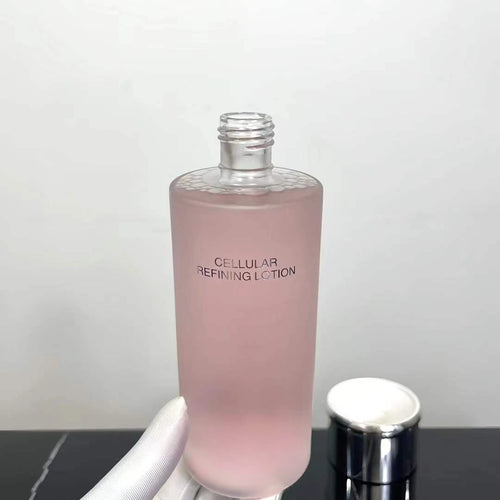 Pink cellular refining lotion bottle with clear cap